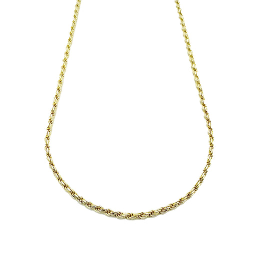 A gold-plated sterling silver rope chain necklace hanging against a white backdrop.