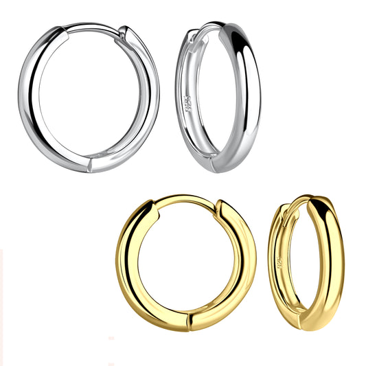 Two pair of slightly chunky hoop earrings floating against a white backdrop. The pair on top are sterling silver. One earring is facing slightly to the right. The other is facing left. The pair on the bottom are gold-plated sterling silver. One earring is facing slightly to the right. The other is facing left. 